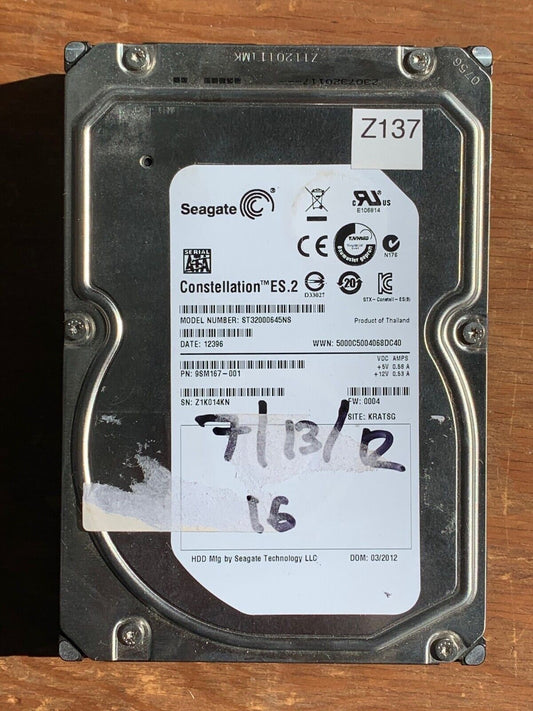 ST32000645NS – 100611023 Rev B – S/N: Z1K014KN – P/N: 9SM167-001 – F/W: 0004 – Site: KRATSG – Date: 12396 – 2TB – 3.5" – SATA