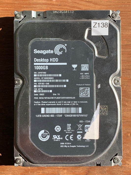 ST1000DM003 – 100724095 REV A – S/N: Z4Y0TV62 – P/N: 1ER162-040 – F/W: AP14 – Site: TK – Date: 15022 – 1TB – 3.5" – SATA